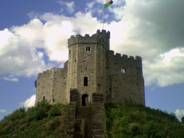 Medieval hilltop castle ruins overlooking Welsh countryside