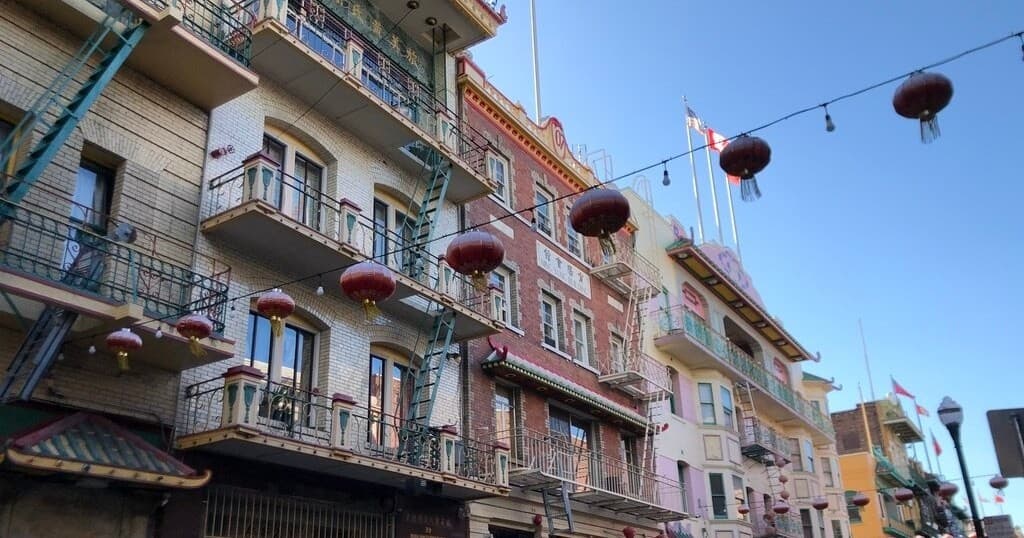 Colorful Chinatown street with hanging lanterns and balconies