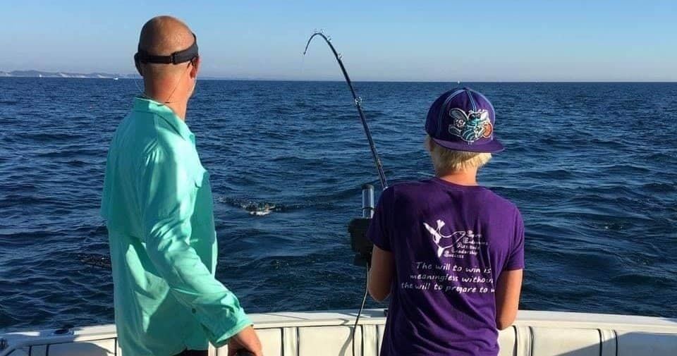 Anglers fishing from charter boat on Lake Michigan offshore