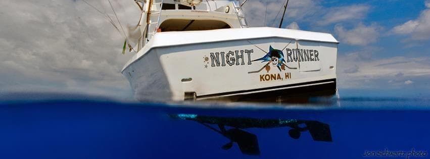 Night Runner fishing charter boat off Kona, split water view