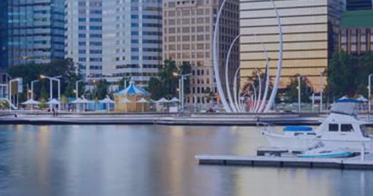 City waterfront marina with moored boats for scenic boat picnics