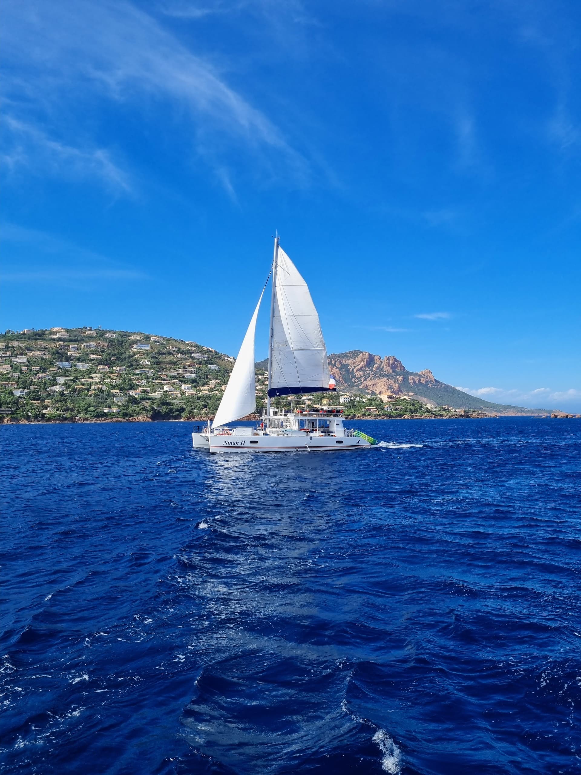 Sailboat cruising deep blue sea off the Javea Denia coastline