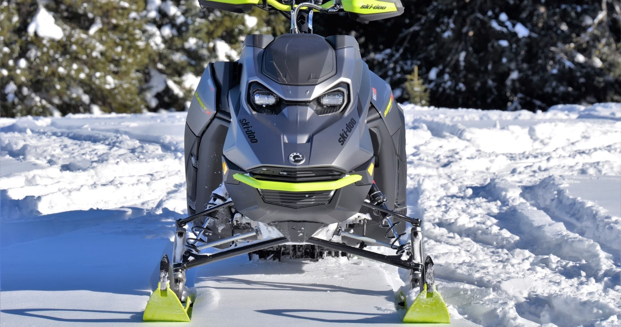 Front view of snowmobile on packed snow, close-up winter setting