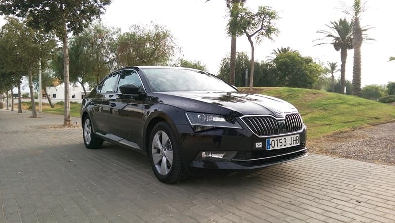 Luxury car parked at sunny marina promenade, seaside view