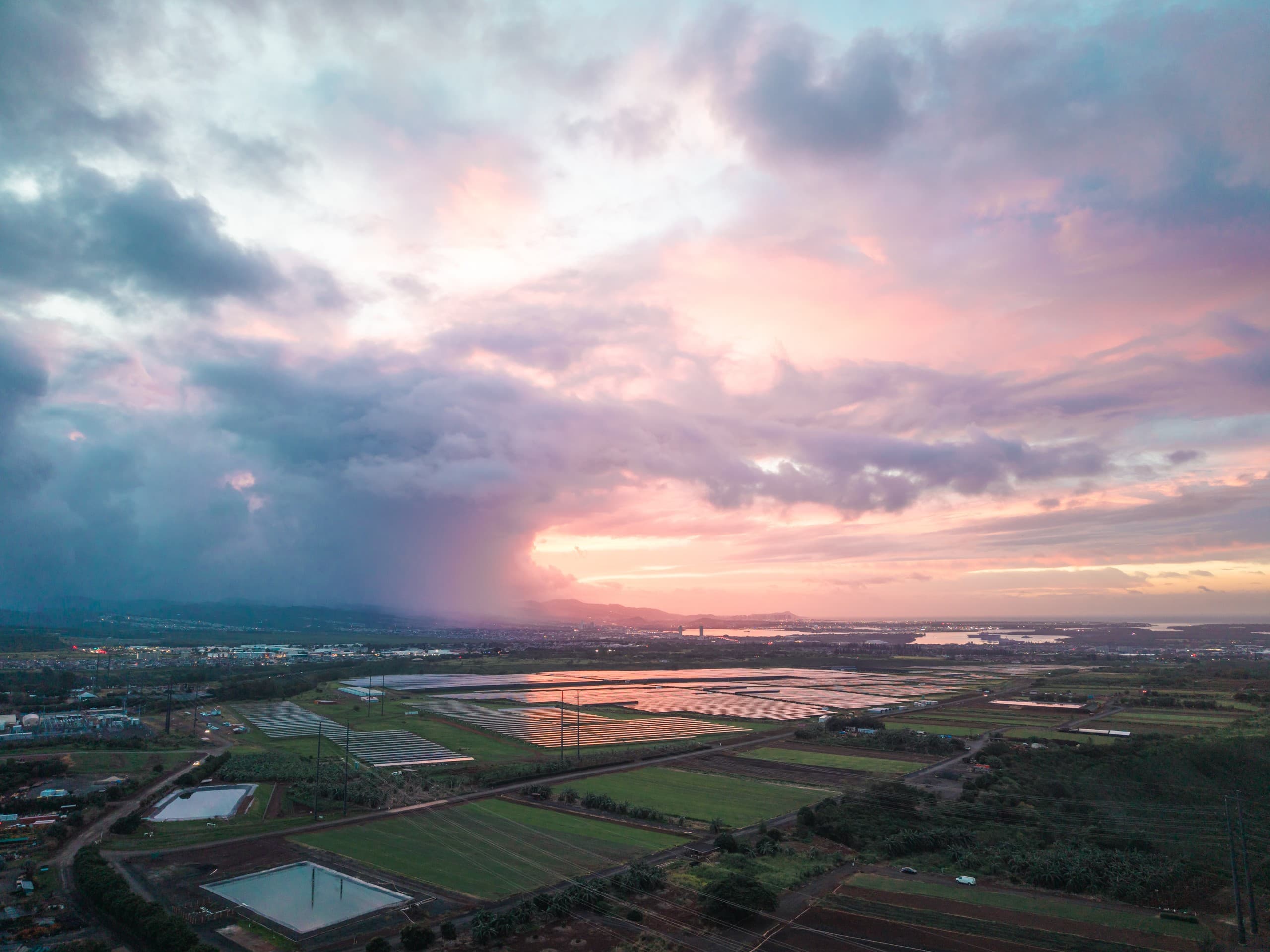 Aerial sunset over Mililani Estate agricultural fields and cacao groves