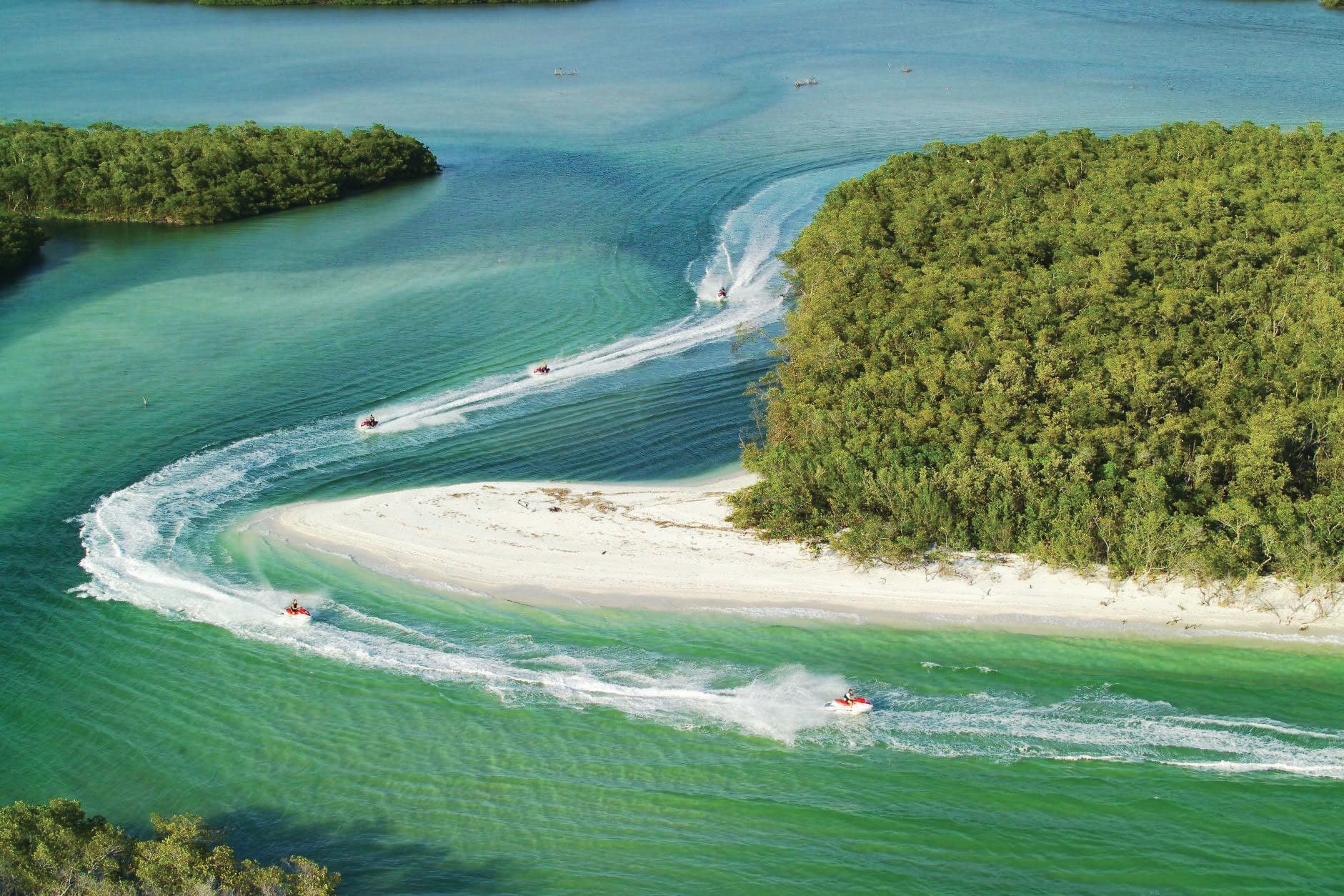 Curving sandbar and turquoise channels with boats, Gulf Coast Florida