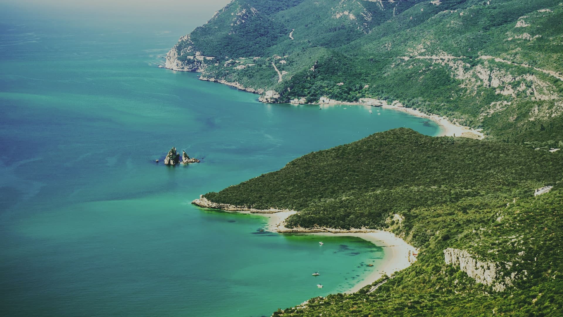 Aerial coastal cliffs and bays, scenic kayaking and exploration