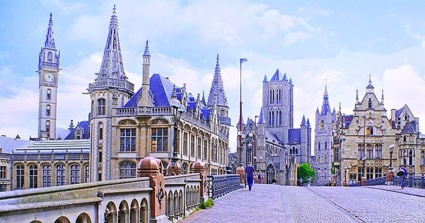 Medieval city spires and plazas in historic Belgian town tour