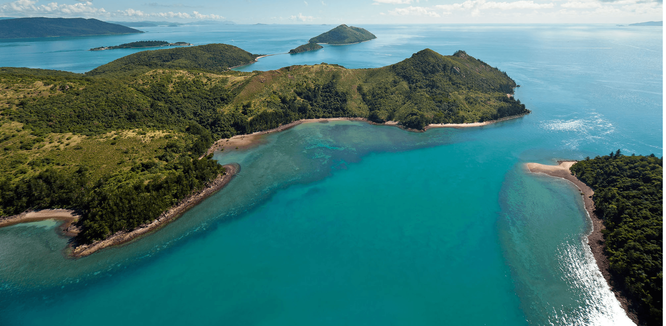 Aerial helicopter view of turquoise bays and islands, Whitsundays