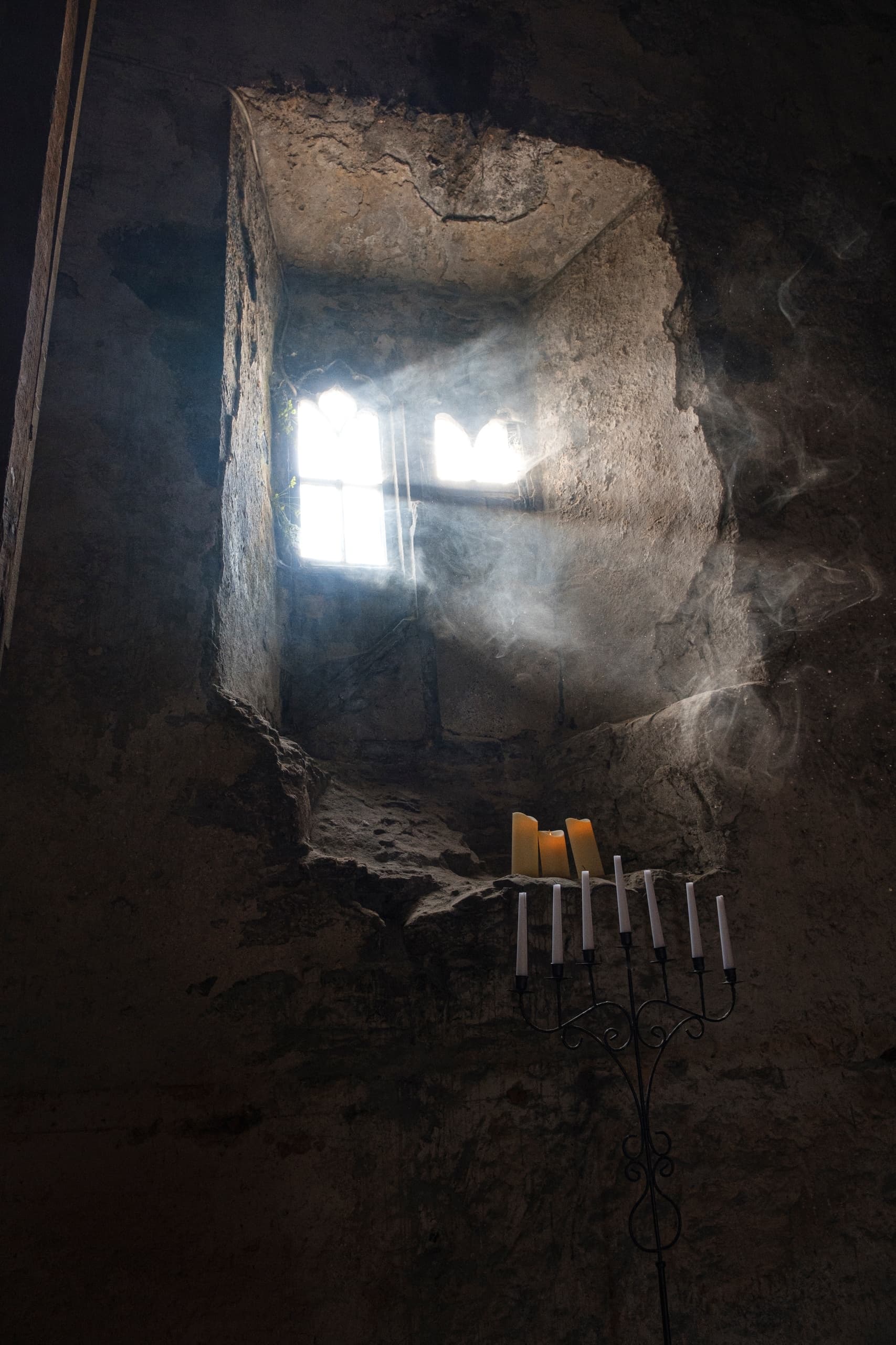 Sunlit chapel window and candles inside St Nicholas chapel