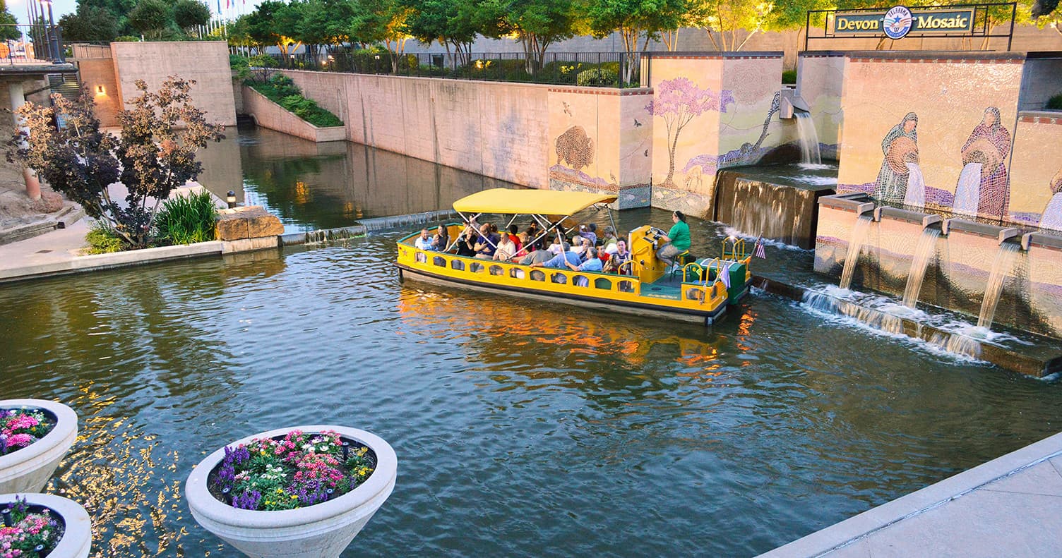 Yellow water taxi cruising Bricktown canal, Oklahoma City