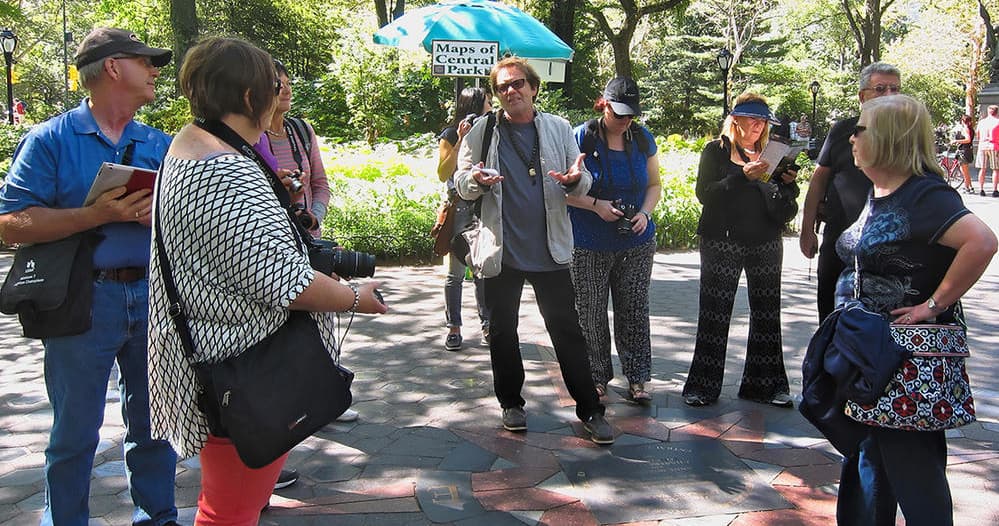 Guided photo walking tour in urban park with group instruction