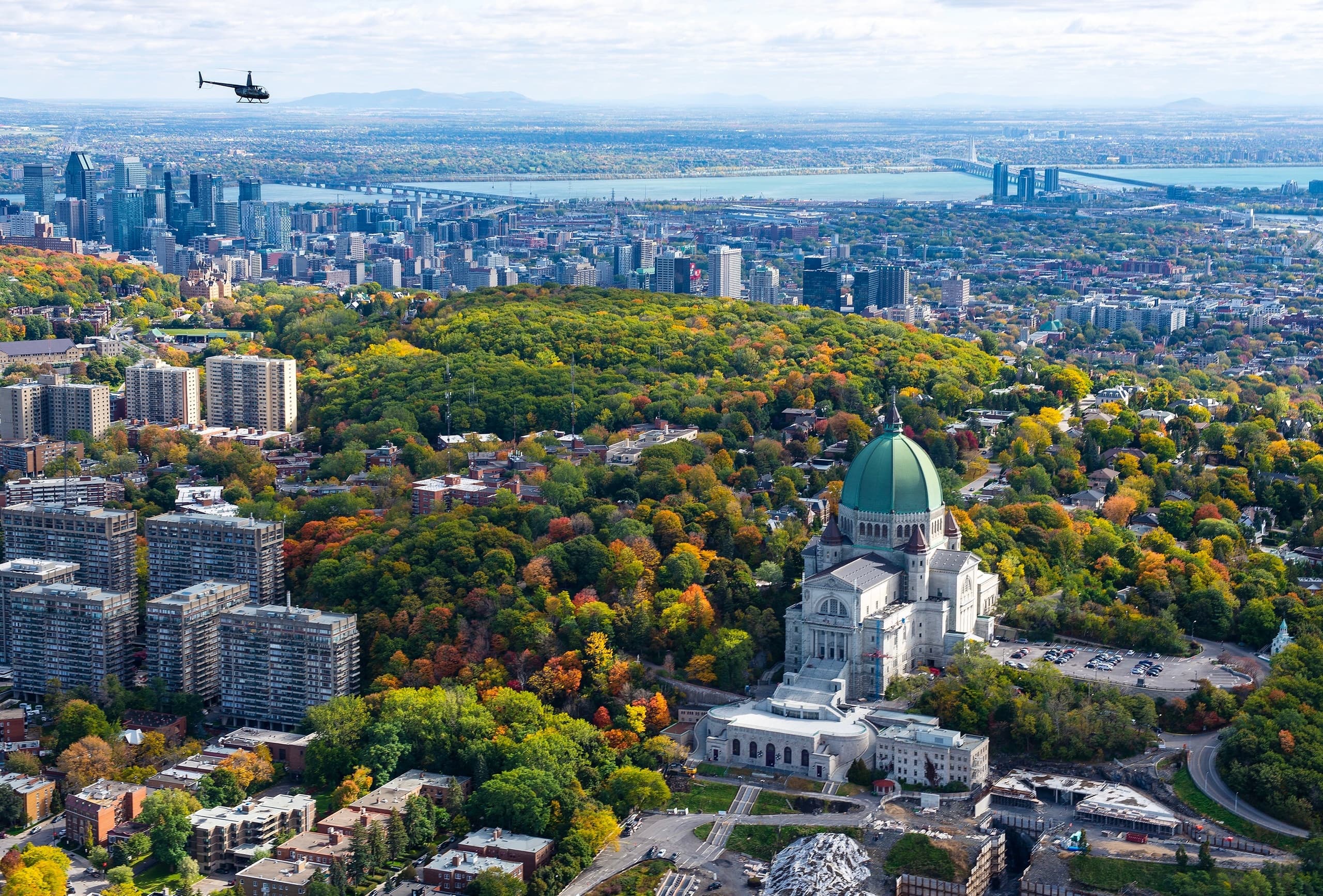 Aerial helicopter view of city skyline and historic cathedral