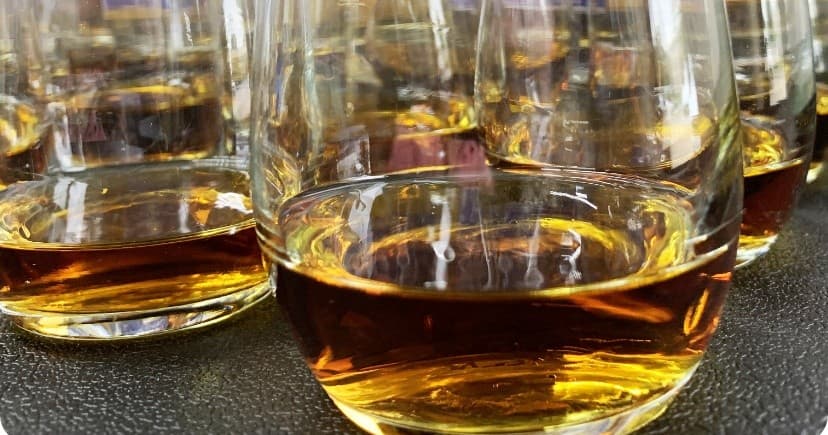 Close-up glasses of bourbon in distillery tasting room