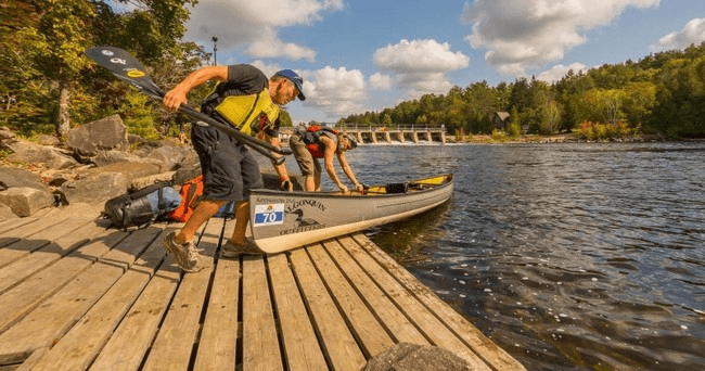 Family beach picnic and waterfront play at Algonquin camping area