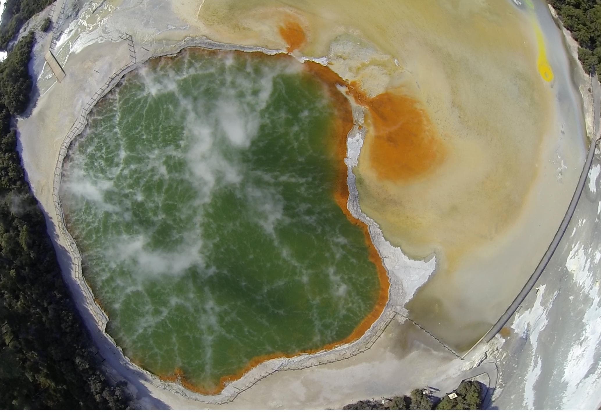 Aerial view of multicolored geothermal spring, thermal basin NZ