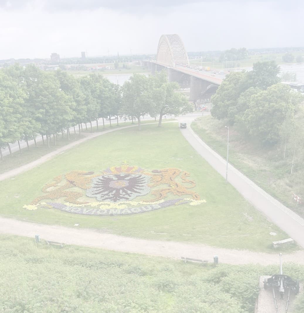 Riverside park with floral carpet display and walking paths