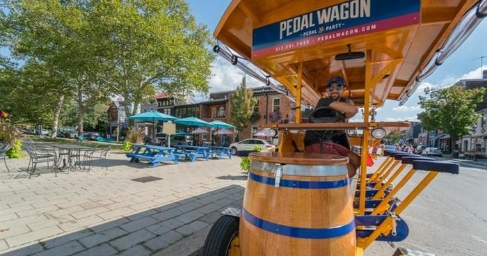 Pedal wagon parked in downtown Covington plaza, outdoor tour