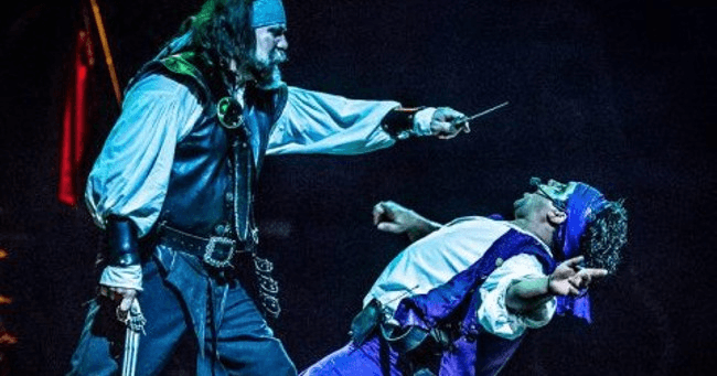 Captain confronting antagonist with sword on Orlando stage