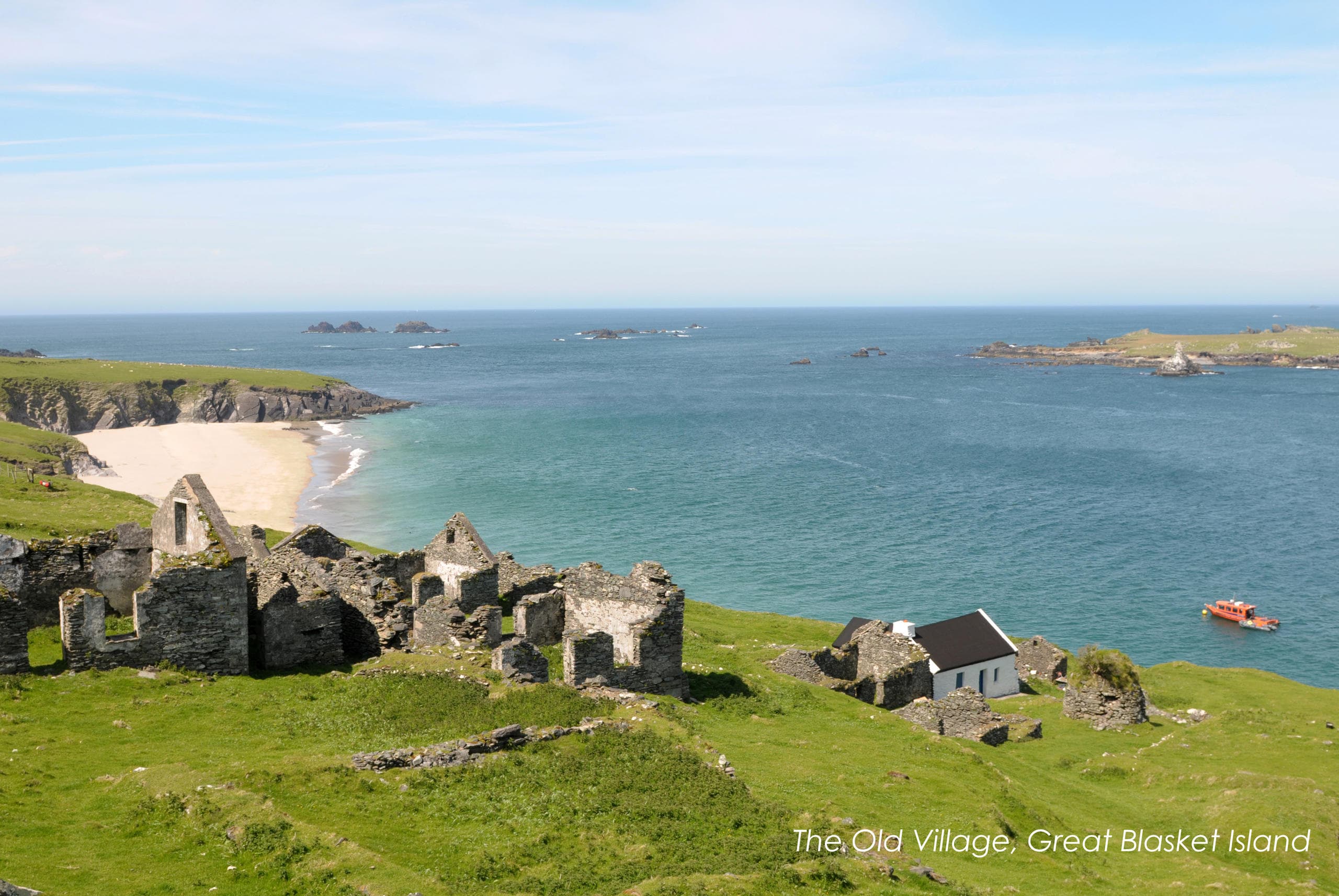 Old village ruins overlooking Atlantic beach on Great Blasket Island