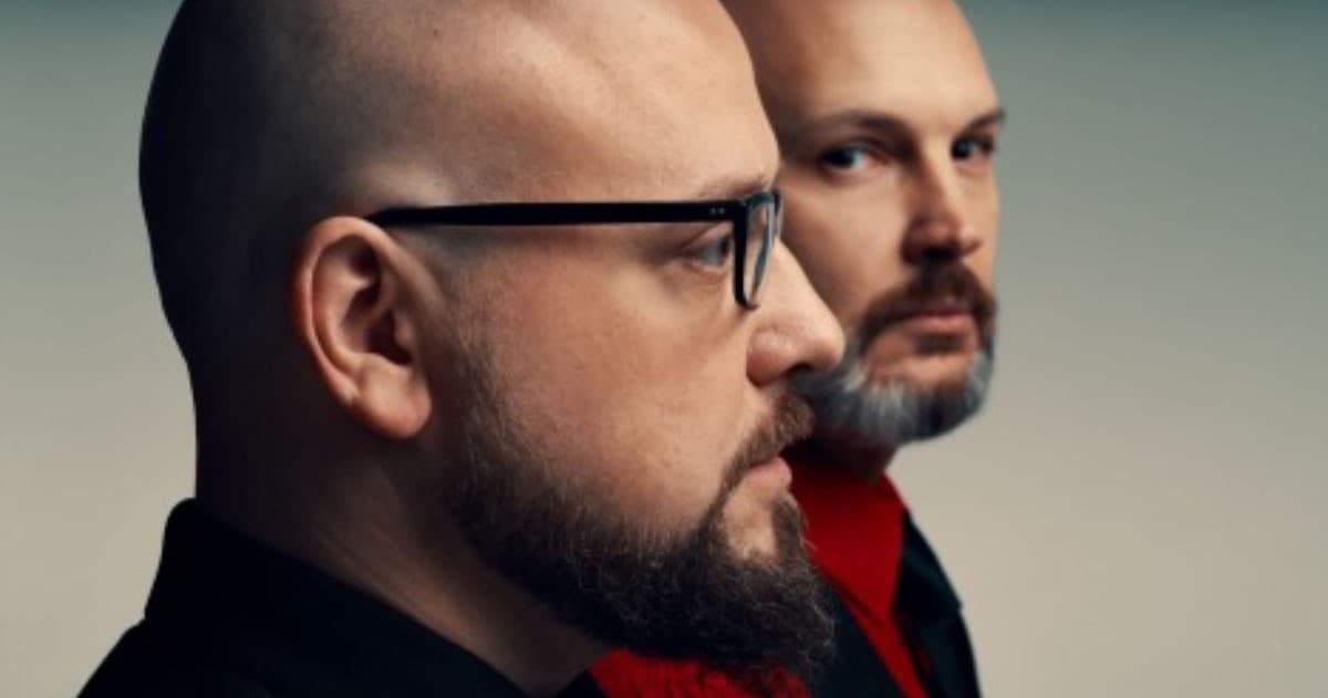 Two actors in dramatic profile portrait, moody theatrical close-up