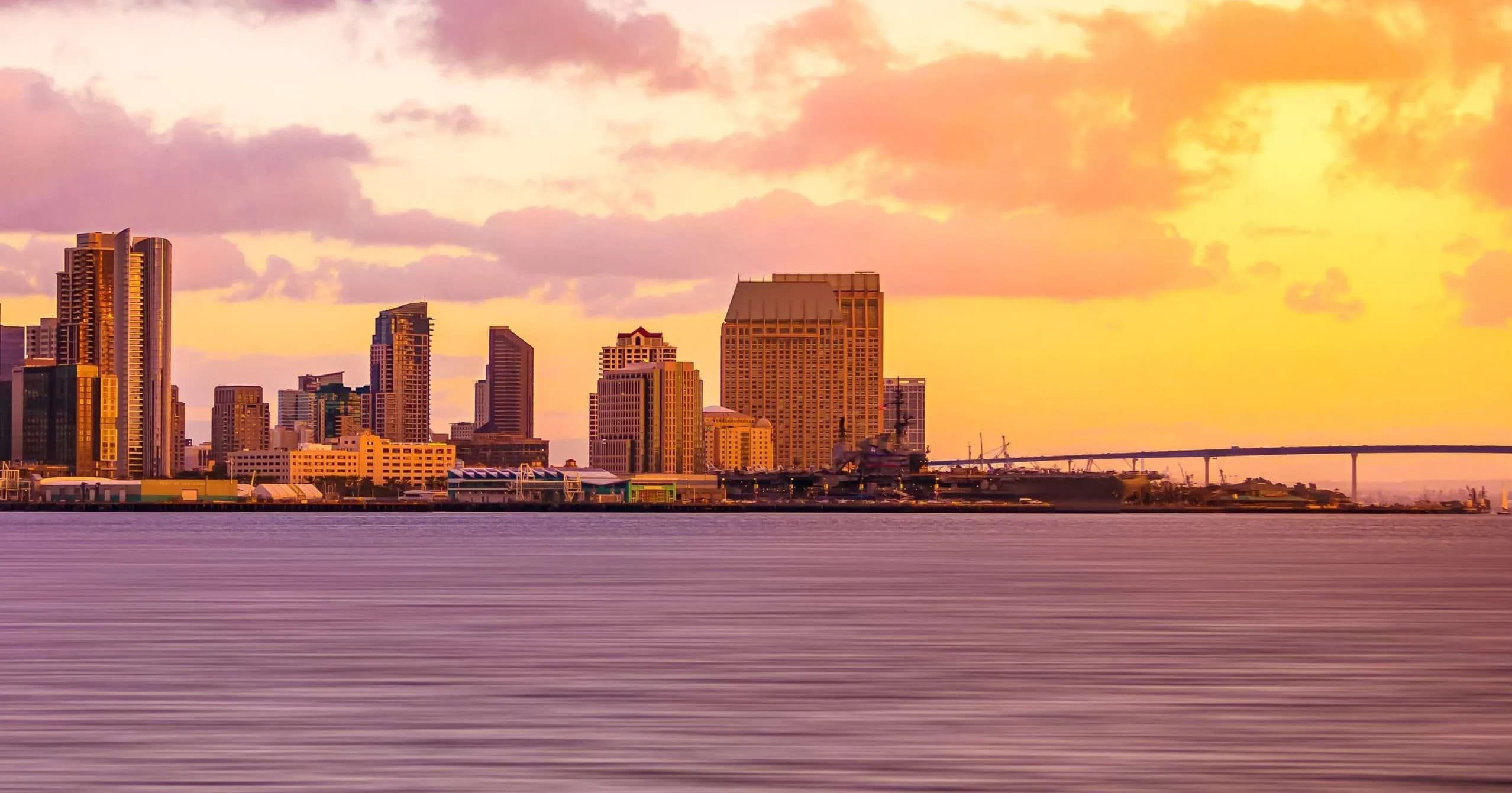 Sunset San Diego skyline over bay with warm golden light