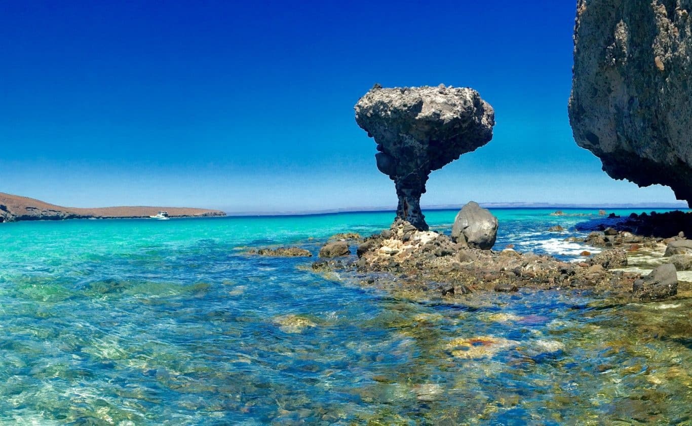 Iconic mushroom rock formation rising from turquoise sea in Mexico