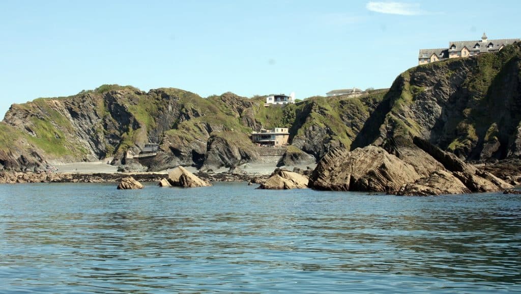 Rocky coastal shoreline viewed from a passenger boat near Ilfracombe