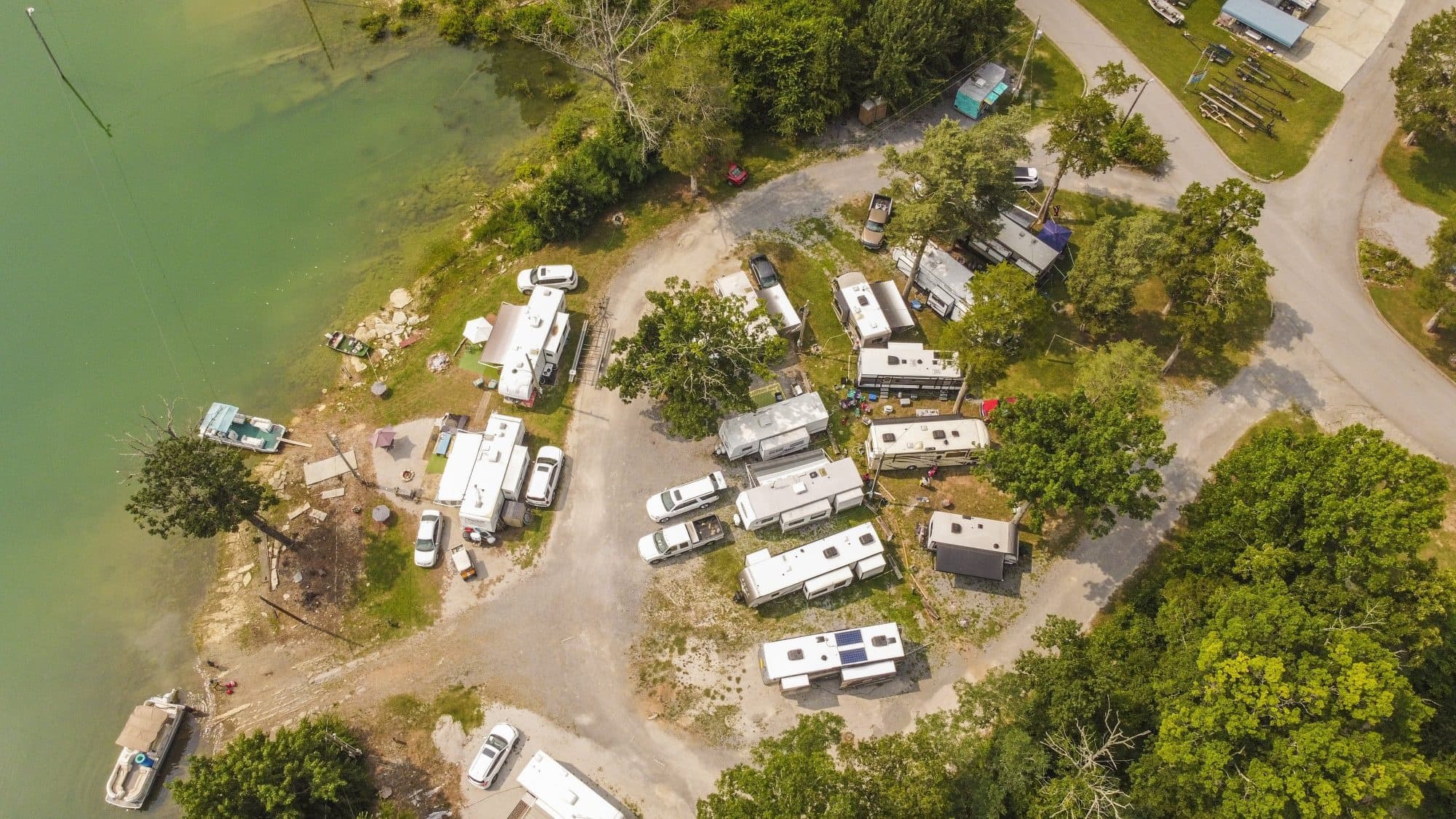 Aerial view of lakeside RV campground and boat ramps