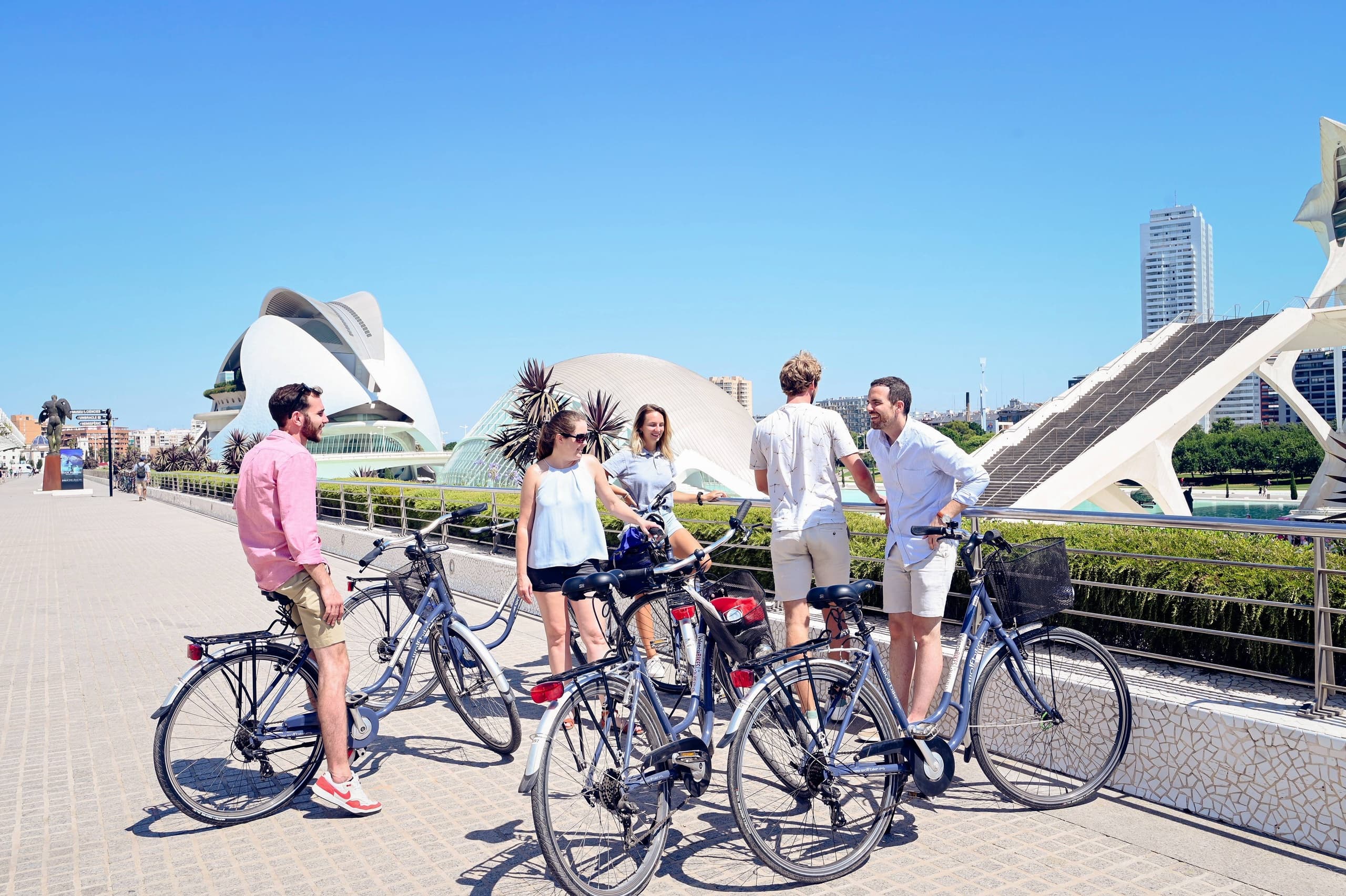 Bicyclists gathered by modern cultural complex in Valencia, Spain