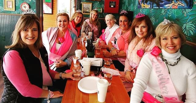 Group on Newport food tour dining indoors at cozy restaurant
