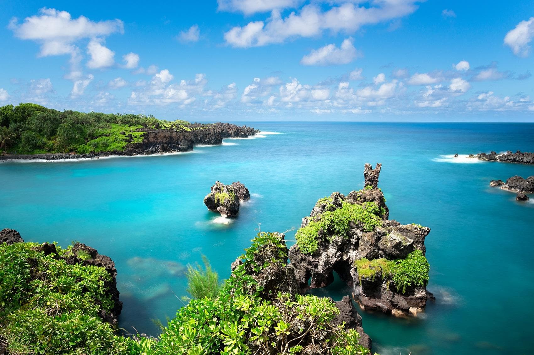 Scenic tropical coastal overlook of turquoise bay with rocky islets