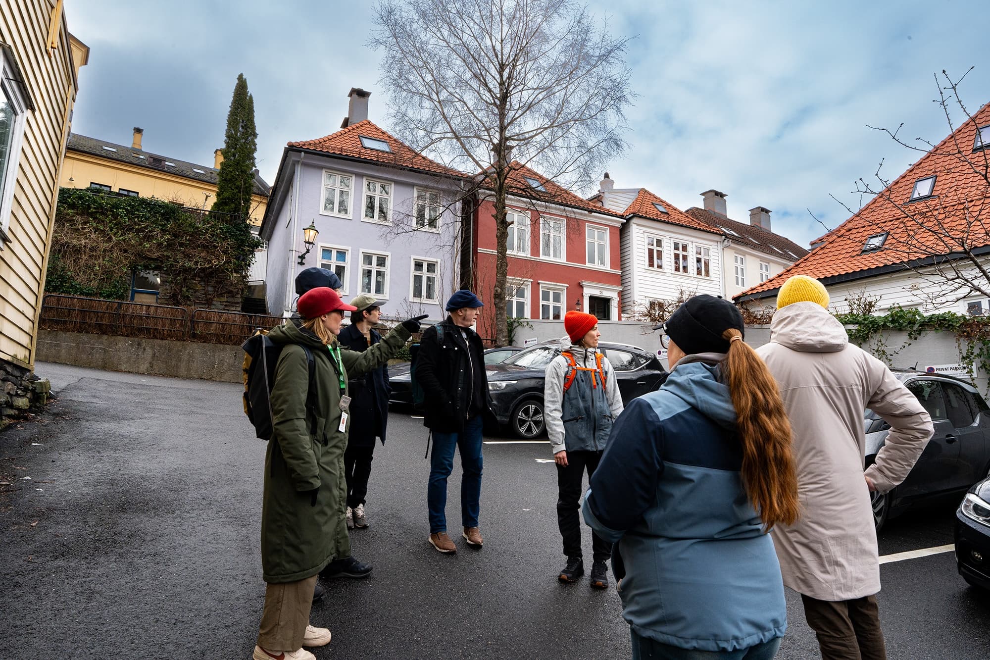 Guided walking group meeting on residential street in Bergen