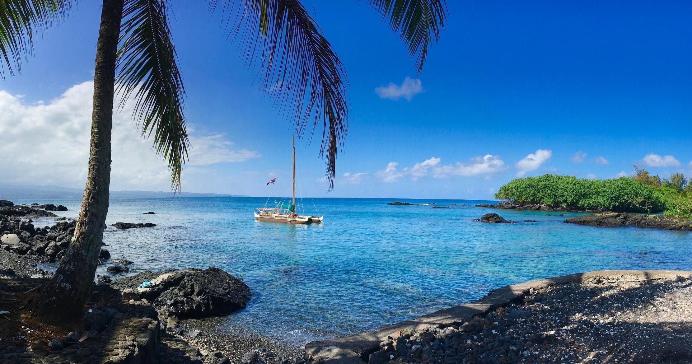 Sunlit coral reef and snorkeling site in tropical lagoon