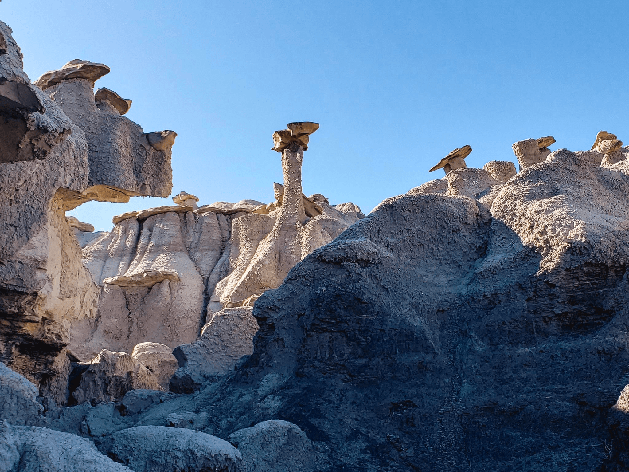 Blue-hour hoodoos and eroded rock pillars in scenic desert
