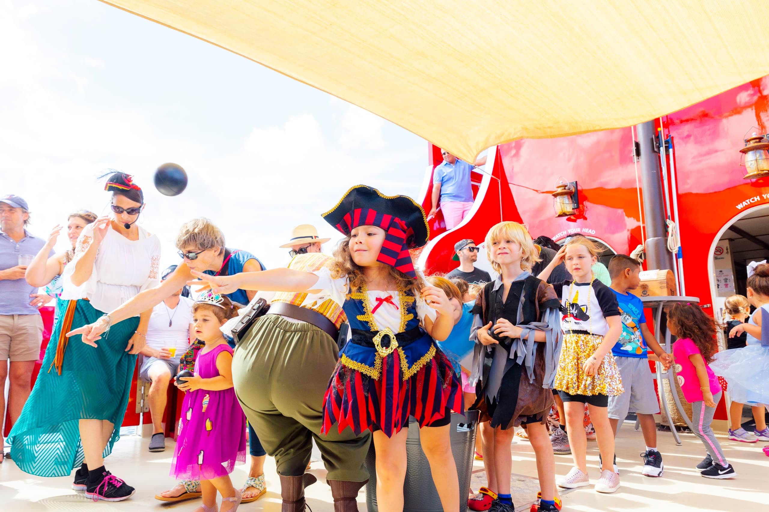 Family pirate-themed kids' party on outdoor ship deck in Tampa Bay