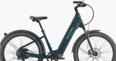 Teal step-through electric bike studio product shot for urban commuting