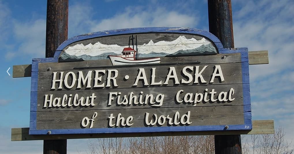 Homer Alaska halibut fishing sign at coastal town entrance