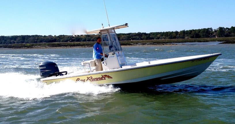 Speedboat skimming coastal waters during scenic offshore charter