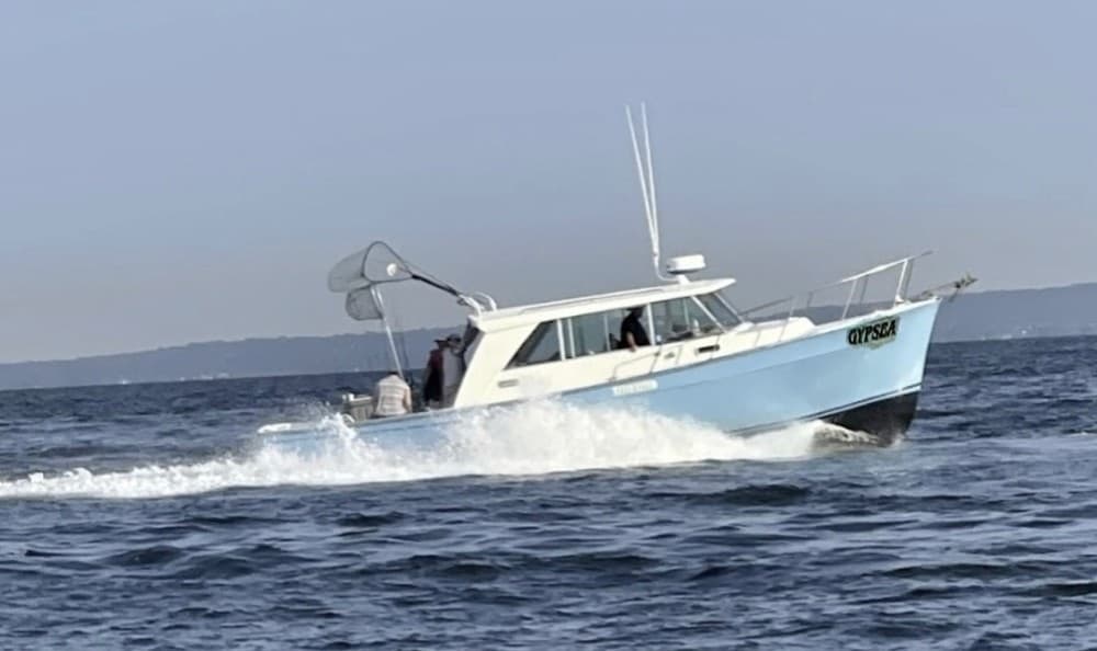 Charter fishing boat cruising offshore waters on ocean trip