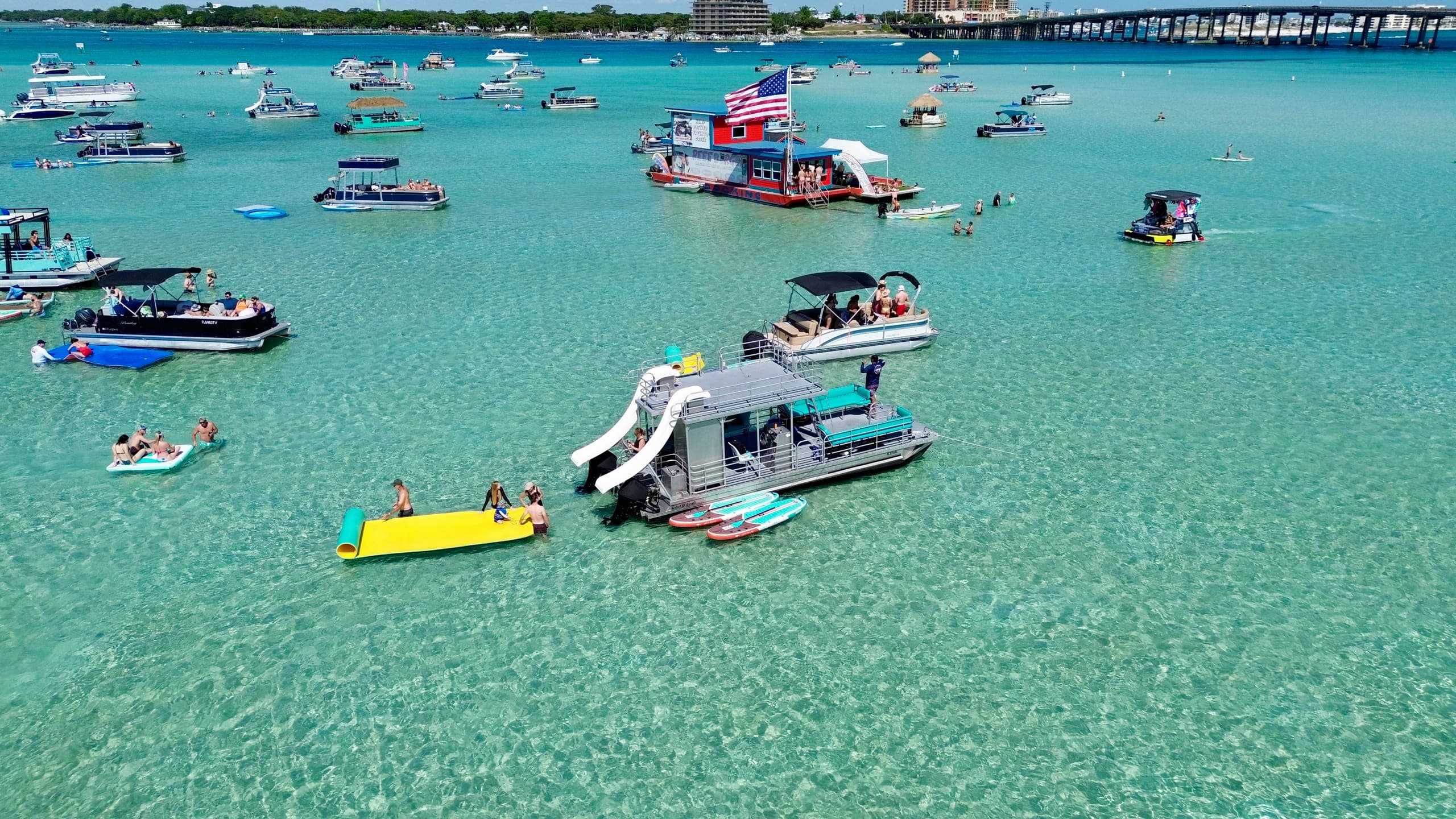 Boats and float platforms over crystal clear shallow water
