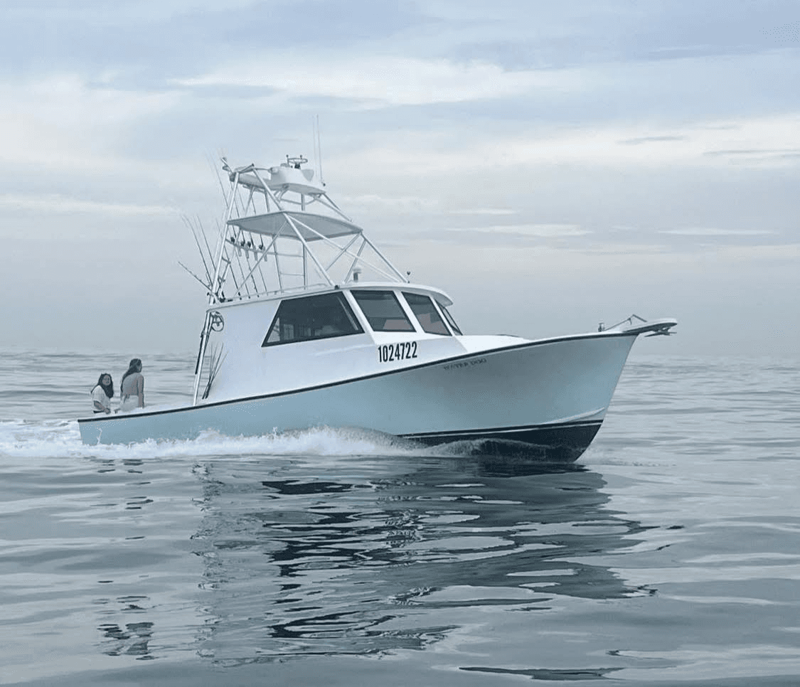 Sportfishing boat cruising calm coastal waters off Orange Beach