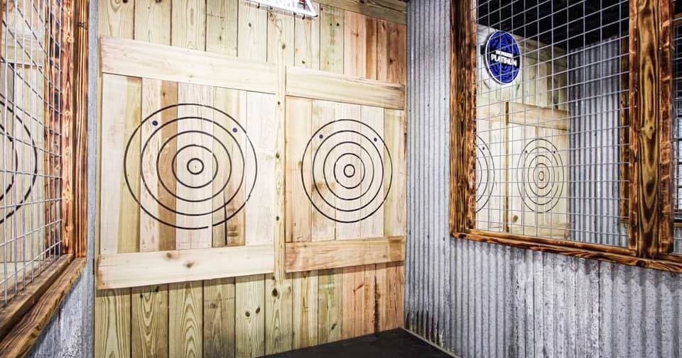 Close-up wooden targets for axe throwing in indoor lane