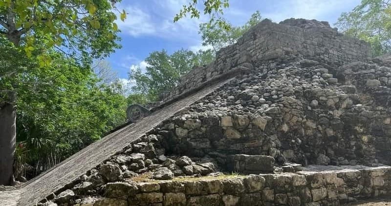 Ancient Mayan pyramid ruins at Coba surrounded by jungle