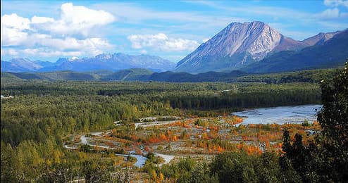 Scenic river valley and mountain vista with autumn foliage, Alaska