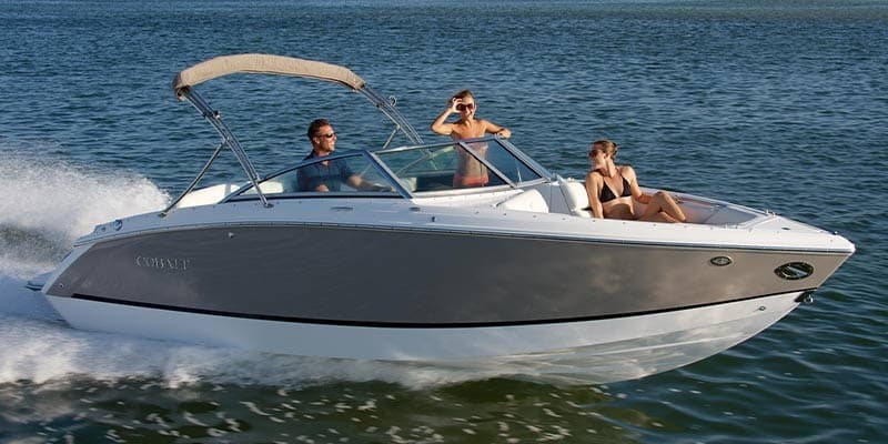Speedboat cruising on open coastal waters with passengers