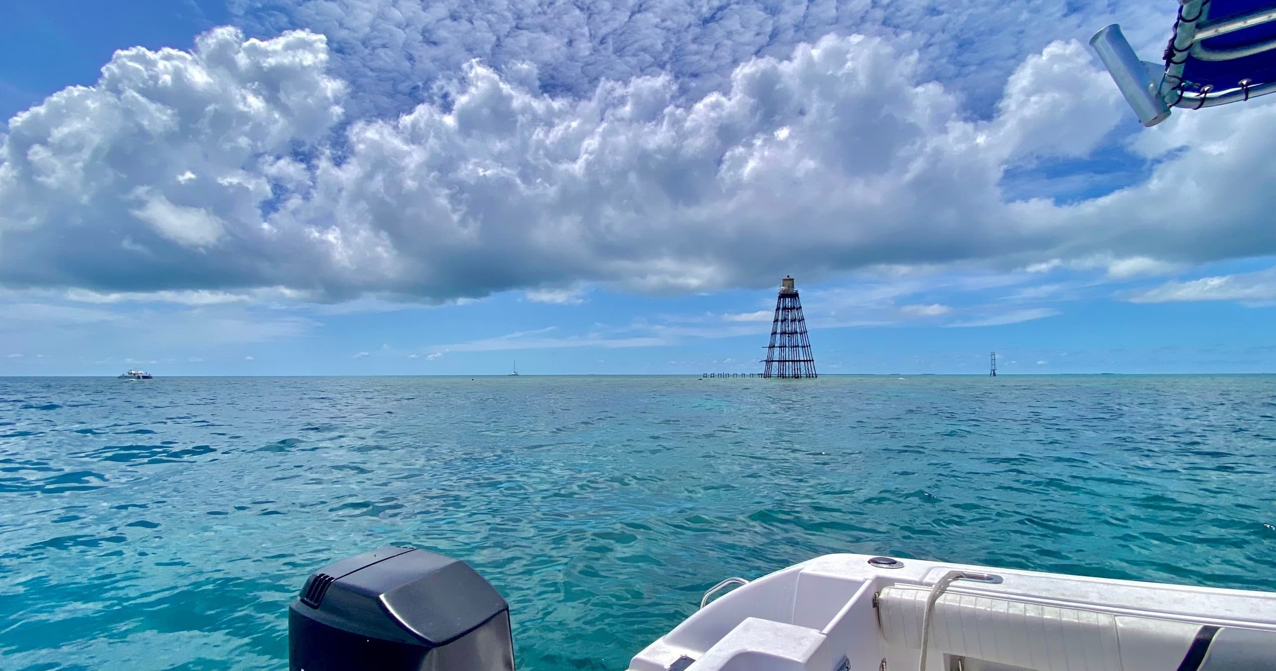 Offshore boat with navigational tower and blue sky, Key West