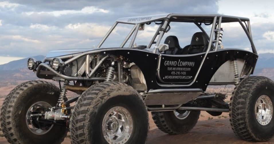 Rock crawler on Moab red rock trail, rugged off-road tour