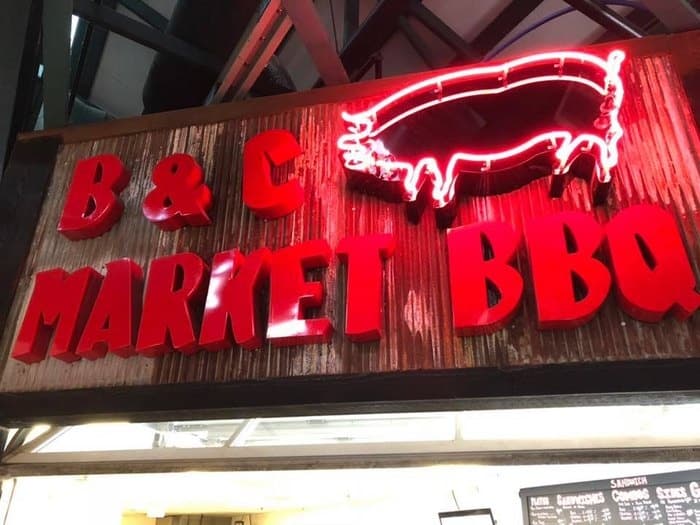 Red neon B&C Market BBQ sign on exterior, Nashville street