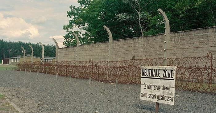 Barbed-wire perimeter and memorial wall at Berlin historic site